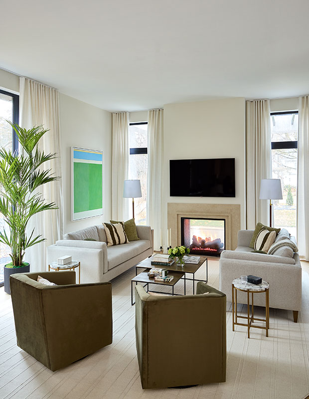 Modern living room with sheer curtains and fireplace