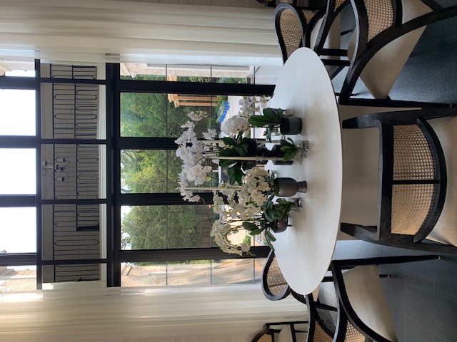 Dining area with sheer curtains