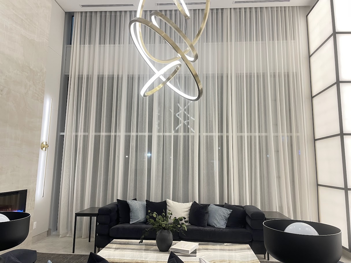 Double-height living room with floor-to-ceiling sheers