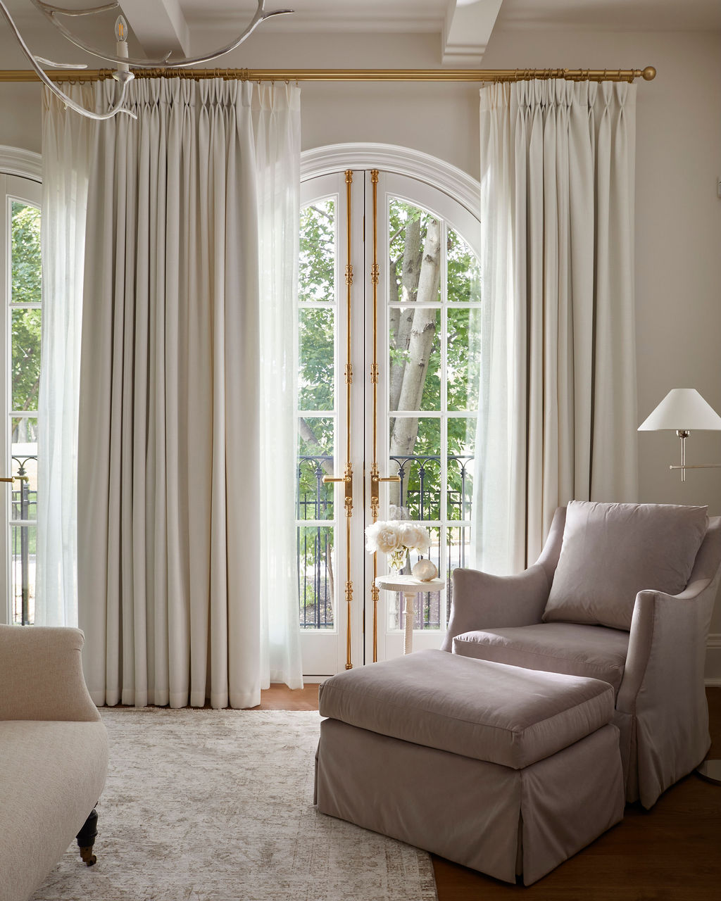 Living room with arched French doors and curtains