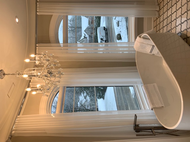 Foyer with custom window treatments