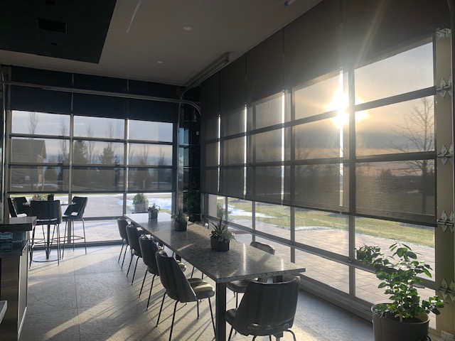 Black solar shades with sunset view
