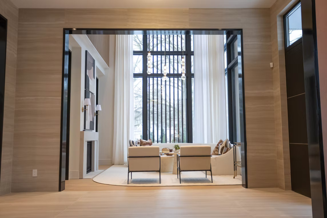 Contemporary sitting room with architectural windows and sheer drapery