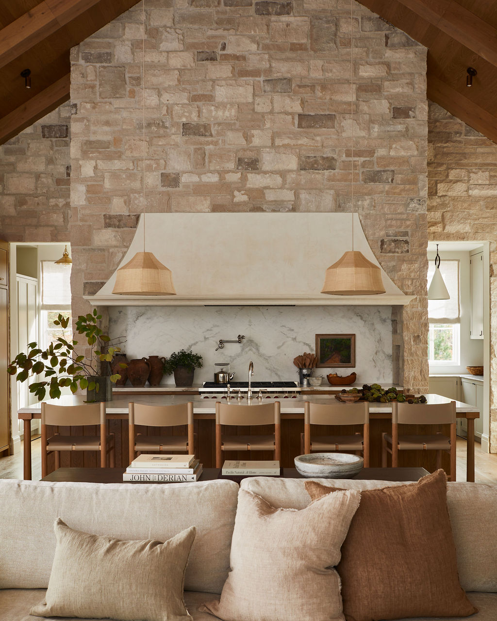 Roman shades in stone accent living space