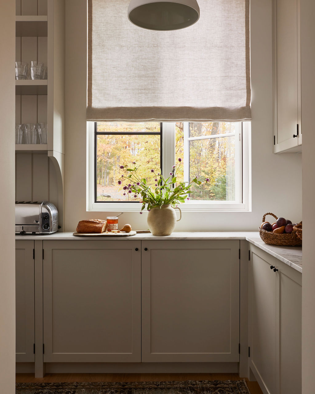 Kitchen with linen roman shade
