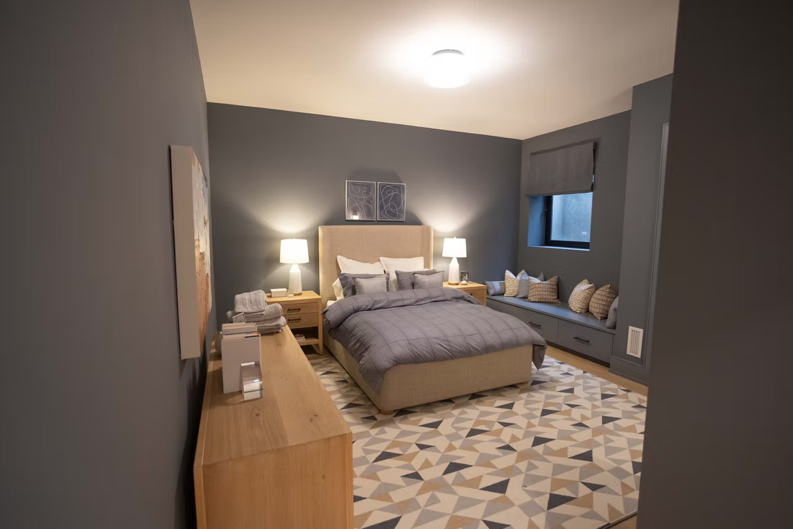 Bedroom with charcoal roman shade and window seat