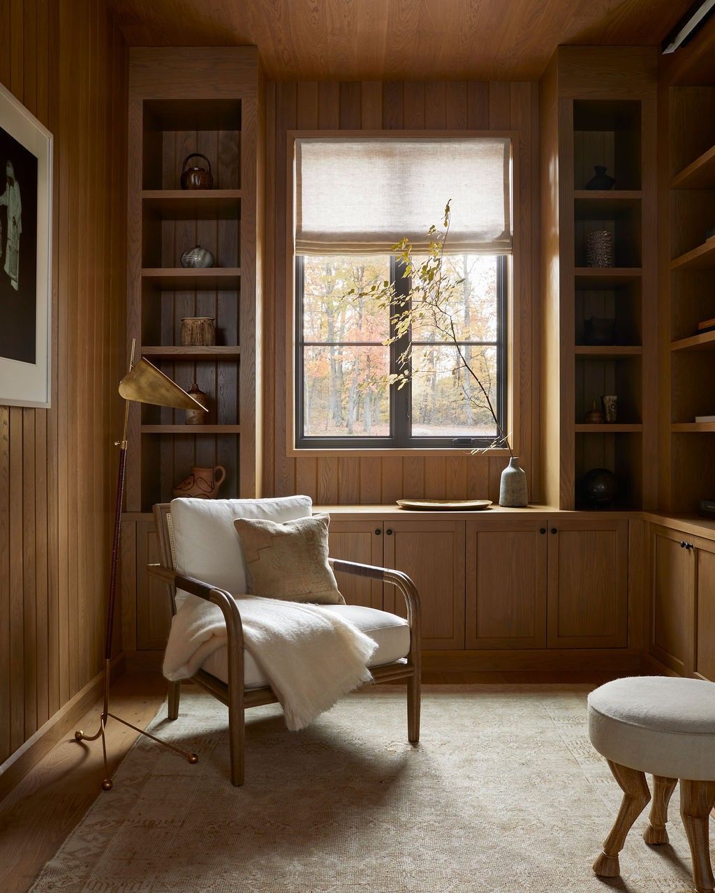 Roman shade in wood-paneled study