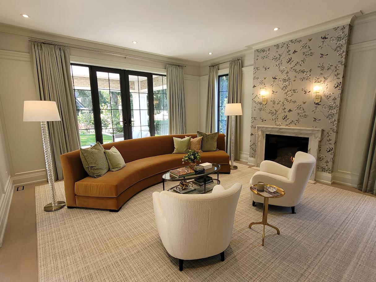 Living room with curved sofa and custom curtains